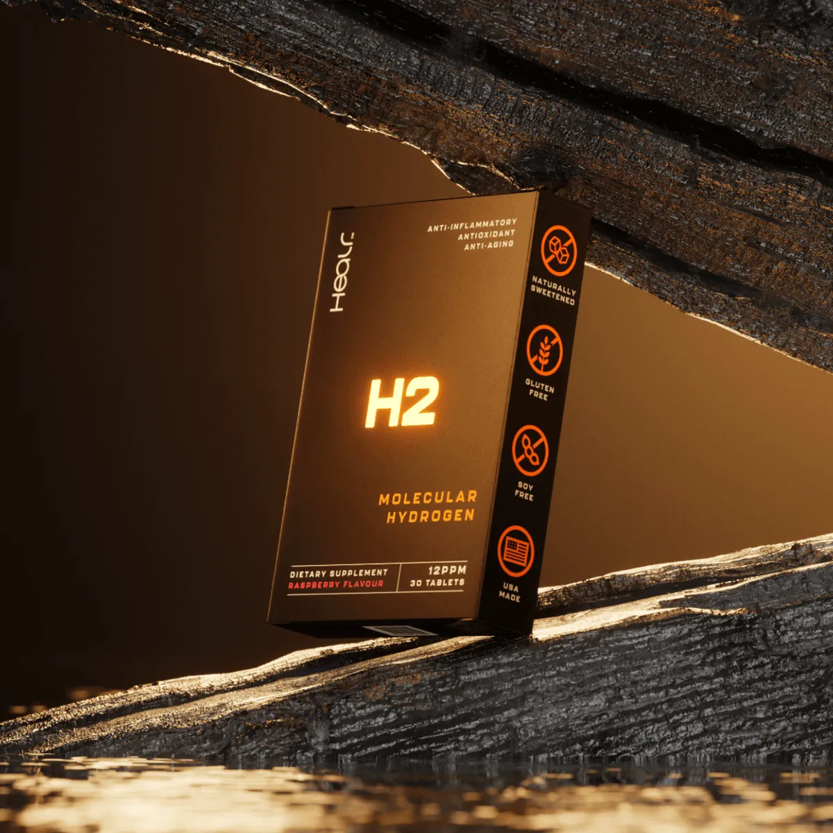 A black HEALR H2 molecular hydrogen tablet box standing on dark wood